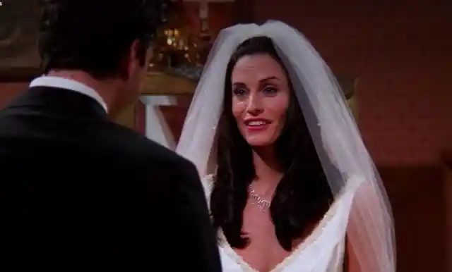 How is Joey dressed at Monica and Chandler’s wedding?