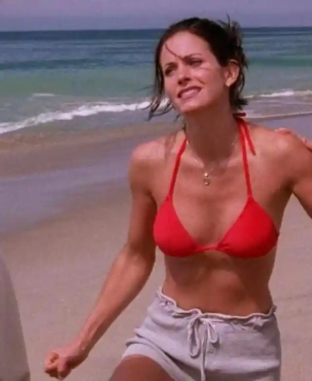 Who pees on Monica after she is stung by a jellyfish?