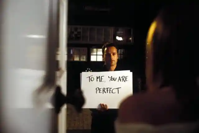 Which romantic comedy made hearts flutter with this iconic cue card stunt?